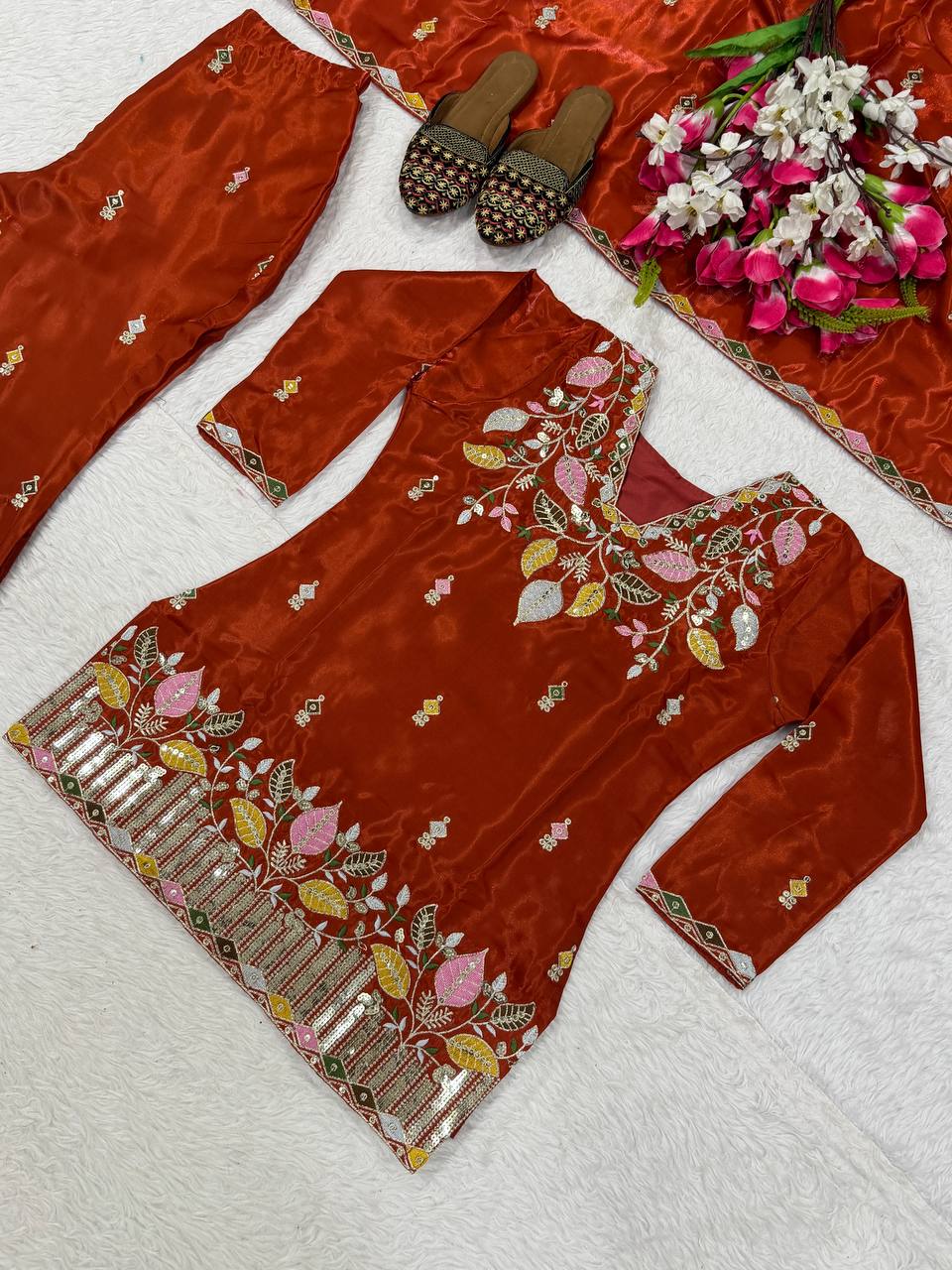 Elegant Rust Orange Silk Kurta and Flared Palazzo Set Adorned with Intricate Multicolored Botanical Embroidery and Mirror Work